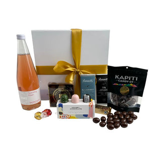 Gift Box Image Large white gift box with Phoenix Alcohol Free Sparkling Rose 750ml,Chocolate covered almonds, House of Chocolate bonbons three pack, Luxury Devonport Chocolates nine packs, two Bennett's of Mangawhai chocolate bars, cococups with strawberry and two pieces of Lindt chocolate Batenburgs Gift Baskets Auckland