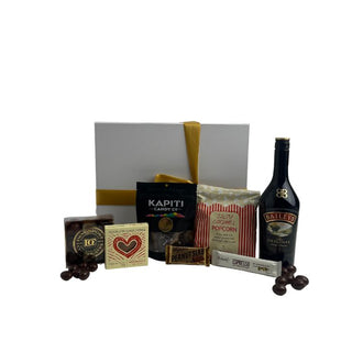 Gift Box Image Large white gift box with ribbon and card, packed with 750ml Bailey's liqueur, peanut slab, caramel popcorn, russian fudge, Bennett's Espresso bar, Devonport Chocolate selection and chocolate almonds Batenburgs Gift Baskets Auckland