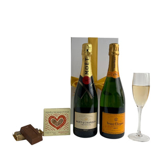 Gift Box Image Large white deluxe gift box with Moët and Chandon Imperial Champagne, Veuve Clicquot Brut Yellow label both 750ml, Russian fudge and a peanut slab. Batenburgs Gift Baskets Auckland