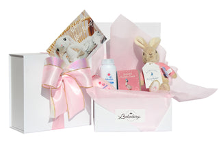 Flopsy bunny baby shower gift box for girl in pink with Flopsy Bunny toy, Petter Rabbit book and John and Johnson bath time products. By Batenburgs Gift Hampers.