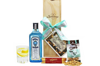 Gift Box Image Single bottle wooden gift box with Bombay Sapphire London Dry Gin, two Whittaker's dark chocolate bars 60 grams and sea salted peanuts