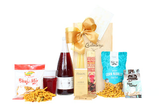 Gift Box Image Medium wooden gift box, with Bhuja Mix, Phoenix Sparkling Red Grape juice 750ml, Bennett's of Mangawhai chocolate bar, Bierstick, crispy corn nibbles and sea salted peanuts Batenburgs Gift Baskets Auckland 