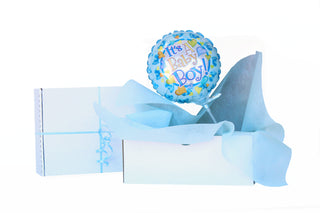 Blue balloon that says it's a baby boy, in a box with blue Vilene