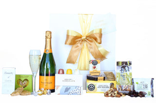 Gift Box Image Wooden gift box with Veuve Clicquot Brut Yellow Label, Russian fudge, Bennett's of Mangawhai chocolate, House of Chocolate bonbon three pack, fruit paste, crackers, raw nuts and olives Batenburgs Gift Baskets Auckland 
