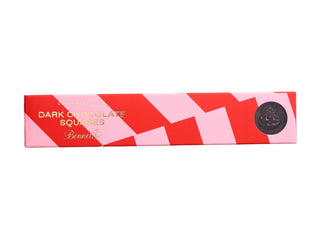 Rectangular product box with red and pink geometric design on a beige background
