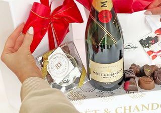 Valentine's Day white gift box and satin red bow with chocolates and Moet Champagne by Batenburgs Gift Hampers.
