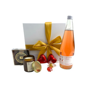  Gift Box Image Medium white gift box, Phoenix Alcohol Free Sparkling Rose 750ml, Lindt lindor chocolates, chocolate hearts, amberjack candle, davenport chocolates. Batenburgs Gift Baskets Auckland