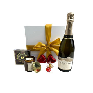 Gift Box Image Medium white gift box, Cloudy Bay Pelorus Brut 750ml, Lindt lindor chocolates, chocolate hearts, amberjack candle, davenport chocolates. Batenburgs Gift Baskets Auckland