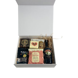 Gift Box Image Large white gift box with ribbon and card, packed with 750ml Bailey's liqueur, peanut slab, caramel popcorn, russian fudge, Bennett's Espresso bar, Devonport Chocolate selection and chocolate almonds, shot from above. Batenburgs Gift Baskets Auckland
