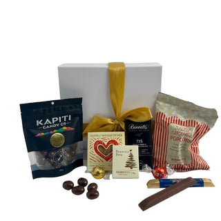 Gift Box Image White gift box with caramel popcorn, Bennett's of Mangawhai chocolate bar, two Whittaker's chocolate bar, Mrs Higgin's brownie bites, chocolate almonds, Russian fudge and two individual Lindt lindor bites Batenburgs Gift Baskets Auckland 