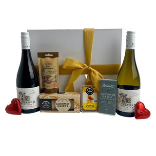 Gift Box Image Large white gift box with two bottles of 750ml Leefield Wine, Sauvignon Blanc and Pinot noir, fruit paste, pistachio nuts, crackers and Bennett's of Mangawhai chocolate message bar thank you