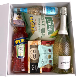 Gift Box Image  with ribbon, bow and gift card. Packed with 750ml prosecco, 700ml Aperol, Fever Tree, olives, Rutherford and Meyer fruit paste and crackers and salsa chips Batenburgs Packaged Gift Baskets Auckland