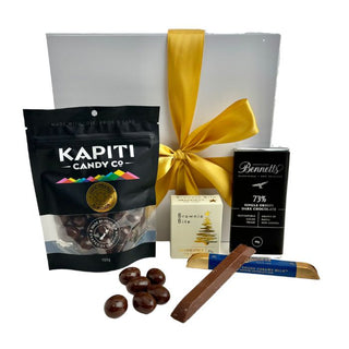 Gift Box Image Small white deluxe gift box with chocolate covered almonds, Bennett's of Mangawhai chocolate bar 60 grams, Whittaker's dark chocolate bar 25 grams and Chocolate Fudge Brownie Bite Batenburgs Gift Baskets Auckland