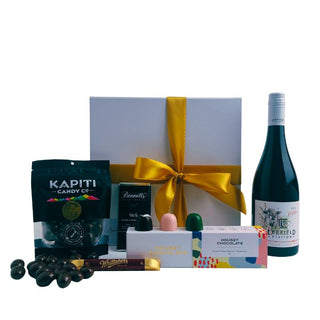 Gift Box Image with Leefield Rose 750ml, Bennett's of Mangawhai chocolate, House of Chocolate bon bons three pack, Whittaker's dark chocolate bar, Chocolate covered almonds Batenburgs Pinot Noir option Gift Baskets Auckland