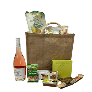Gift Box Image Summer Sustainable picnic gift bag with Rose, Bennetts Chocolate 9 pack, caramel popcorn, sea salted peanuts, bierstick, fruit paste, pretzels, cococup with strawberry, Mexican corn chips, caramel popcorn Batenburgs Gift Baskets Auckland