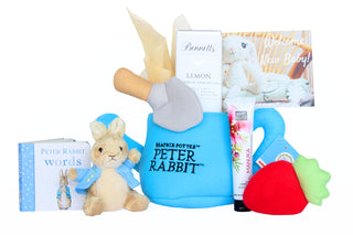 New Zealand Gift Hampers. Peter Rabbit plush watering can with Peter Rabbit soft toy, Peter Rabbit book, hand cream and Bennetts chocolate. Batenburgs Gift Hampers.