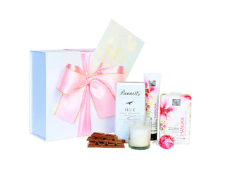 White gift box with Bennett's of Mangawhai chocolate, 50ml tube of hand cream, single Lindt lindor chocolate and bar soap