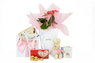Gift Box Image Flowers in white gift bag with pink Vilene, shortbread bites, Flopsy bunny soft toy and Peter Rabbit book  Batenburgs Gift Baskets Auckland 
