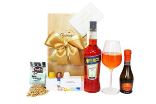 Gift Box Image Medium wooden gift box with 750ml bottle of Aperol, 200ml bottle of Gancia prosecco, sea salted peanuts, House of Chocolate bon bons three pack. Batenburgs Gift Baskets Auckland 
