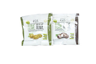 Two packets of marinated green pitted olives
